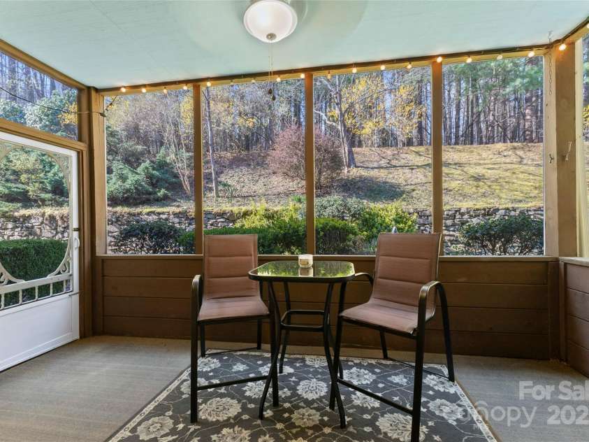 630 Britton Creek Drive, Hendersonville, NC 28791.  MLS# CAR4241236, YatesRealty ID 22259. Screened in sunporch