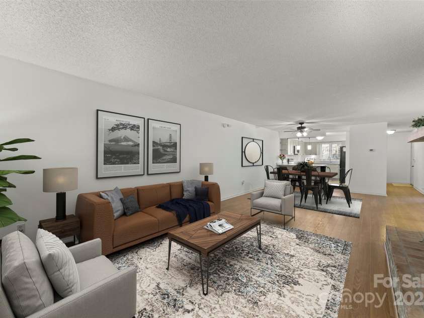 630 Britton Creek Drive, Hendersonville, NC 28791.  MLS# CAR4241236, YatesRealty ID 22259. Virtually staged great room with dining area