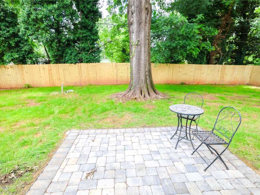 9208 Detroiter Drive, Huntersville, NC 28078.  MLS# CAR4274668, YatesRealty ID 22264. Backyard stone patio