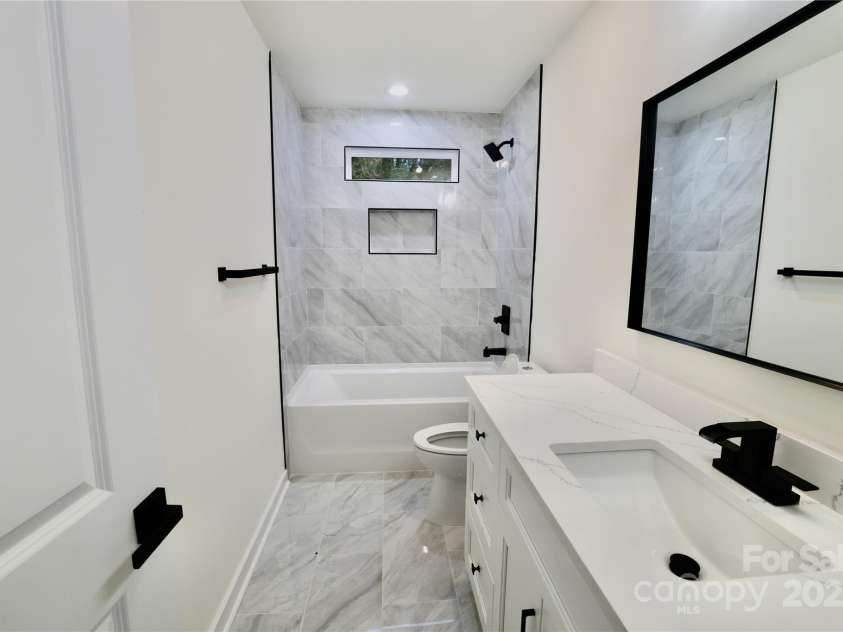 9208 Detroiter Drive, Huntersville, NC 28078.  MLS# CAR4274668, YatesRealty ID 22264. Spare full bathroom w/ tile floor & shower