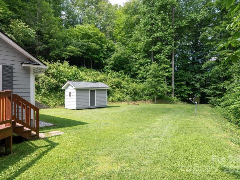 178 Susanna Cove Road, Mars Hill, NC 28754.  MLS# CAR4267675, YatesRealty ID 22266. Level Side Yard and Storage Building