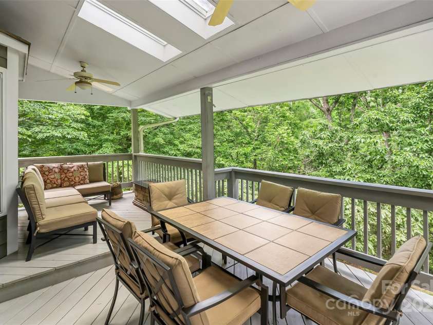 23 Forest Edge Drive, Asheville, NC 28806.  MLS# CAR4272618, YatesRealty ID 22271. Covered deck w/skylights