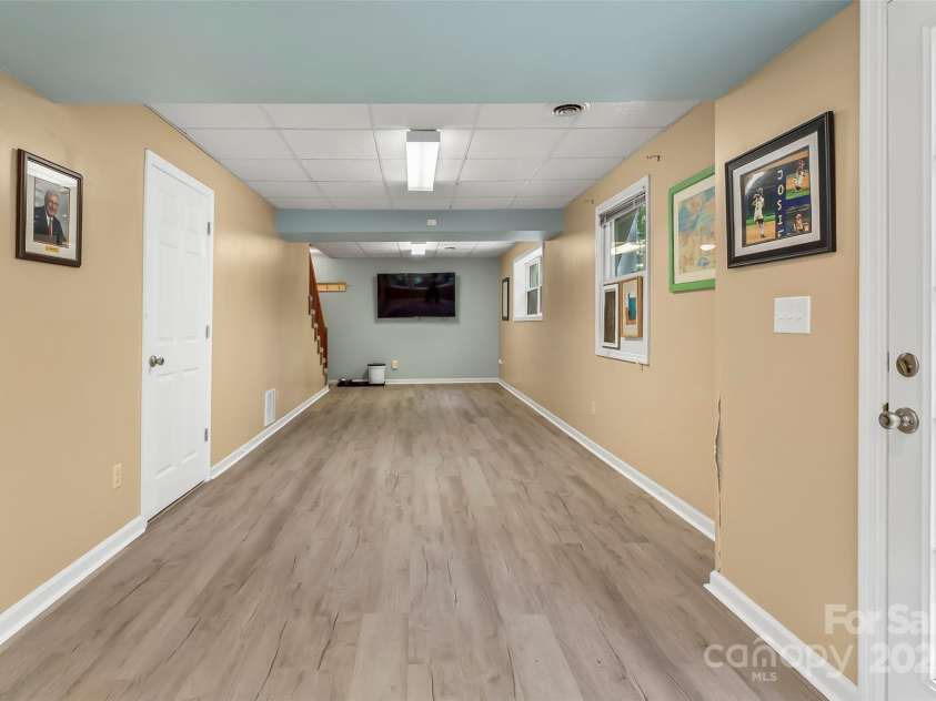 23 Forest Edge Drive, Asheville, NC 28806.  MLS# CAR4272618, YatesRealty ID 22271. Finished basement w/new flooring