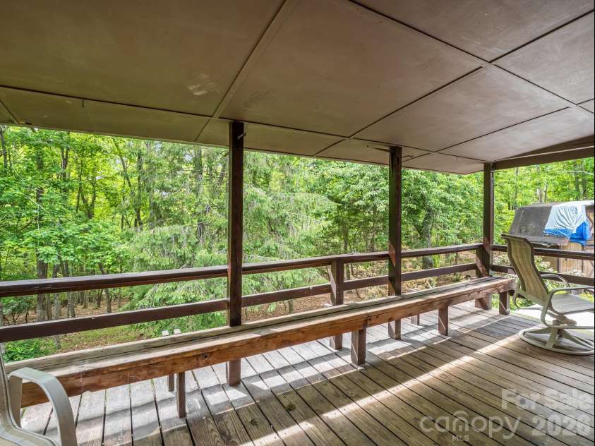92 Greenwood Acres Drive, Mills River, NC 28759.  MLS# CAR4379255, YatesRealty ID 22276. Main level covered back deck