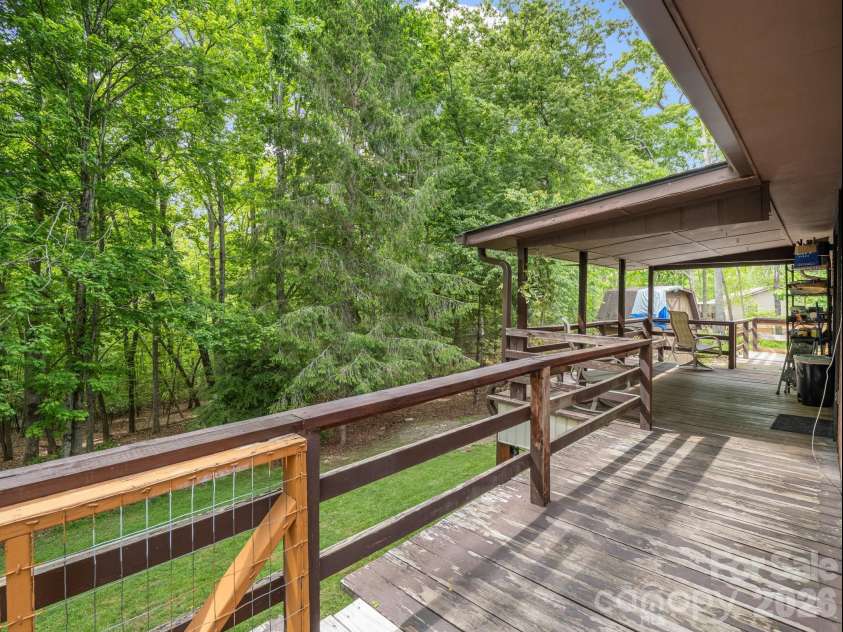 92 Greenwood Acres Drive, Mills River, NC 28759.  MLS# CAR4379255, YatesRealty ID 22276. Main level covered back deck