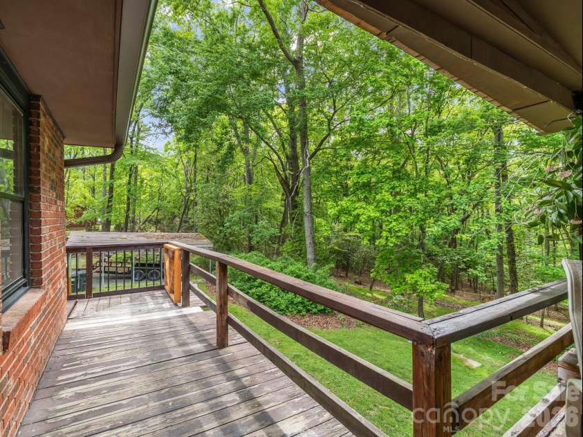 92 Greenwood Acres Drive, Mills River, NC 28759.  MLS# CAR4379255, YatesRealty ID 22276. Main level covered back deck