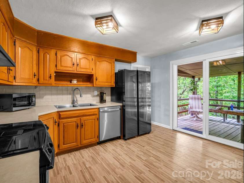 92 Greenwood Acres Drive, Mills River, NC 28759.  MLS# CAR4379255, YatesRealty ID 22276. Main level kitchen