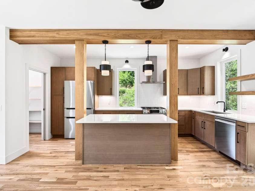 63 Orrinel Way, Asheville, NC 28806.  MLS# CAR4375047, YatesRealty ID 22277. Stunning Exposed and Stained Beams Frame Sparkling Kitchen