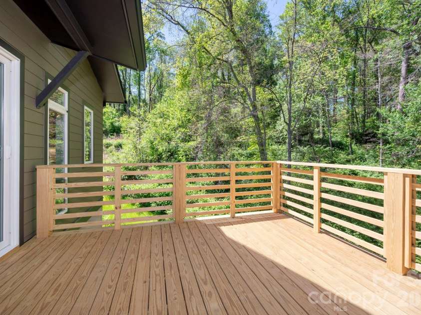 63 Orrinel Way, Asheville, NC 28806.  MLS# CAR4375047, YatesRealty ID 22277. Sunny Deck Overlooks Protected Forest