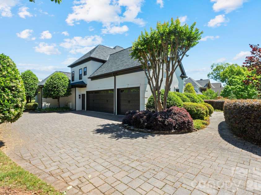 18003 Lochcarron Lane, Cornelius, NC 28031.  MLS# CAR4377616, YatesRealty ID 22279. 3 car garage with EV charger