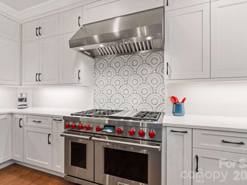 18003 Lochcarron Lane, Cornelius, NC 28031.  MLS# CAR4377616, YatesRealty ID 22279. Kitchen with Wolf gas range