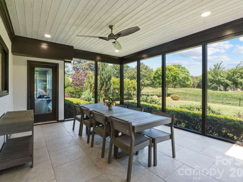 18003 Lochcarron Lane, Cornelius, NC 28031.  MLS# CAR4377616, YatesRealty ID 22279. Oversized screened porch 