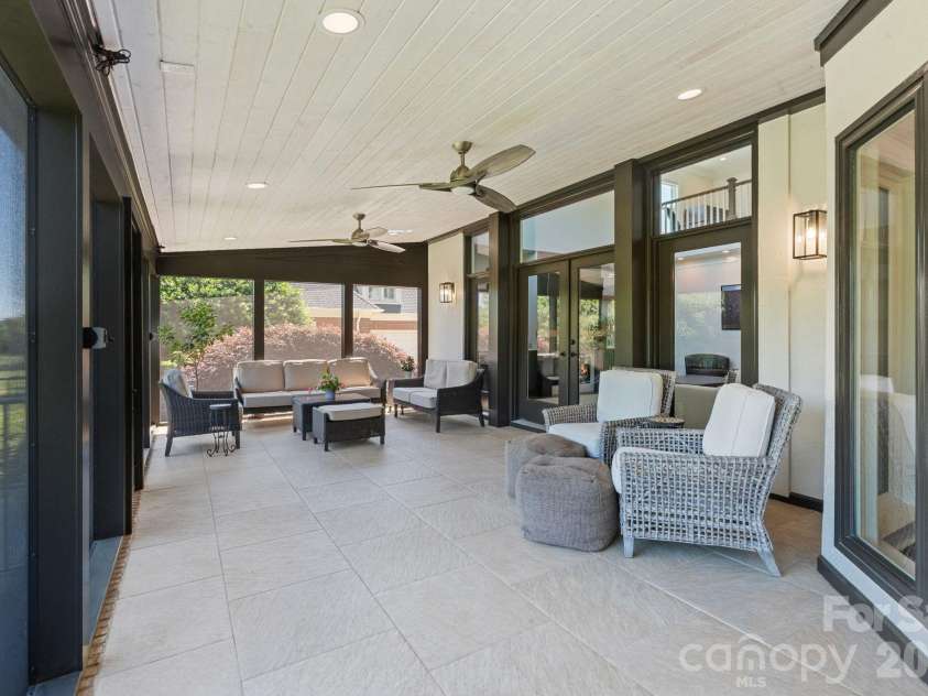 18003 Lochcarron Lane, Cornelius, NC 28031.  MLS# CAR4377616, YatesRealty ID 22279. Oversized screened porch 