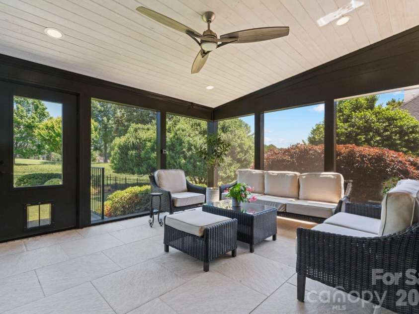 18003 Lochcarron Lane, Cornelius, NC 28031.  MLS# CAR4377616, YatesRealty ID 22279. Oversized screened porch 