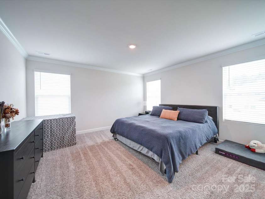 102 Guardian Gate Drive, Mooresville, NC 28115.  MLS# CAR4180685, YatesRealty ID 2228. PRIMARY BEDROOM is spacious and provides natural light.