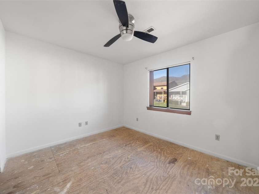 94 Market Street, Maggie Valley, NC 28751.  MLS# CAR4277066, YatesRealty ID 2228. 1st bedroom