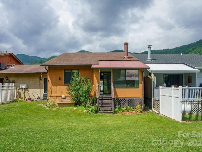 94 Market Street, Maggie Valley, NC 28751.  MLS# CAR4277066, YatesRealty ID 2228. Access to the garage from back yard