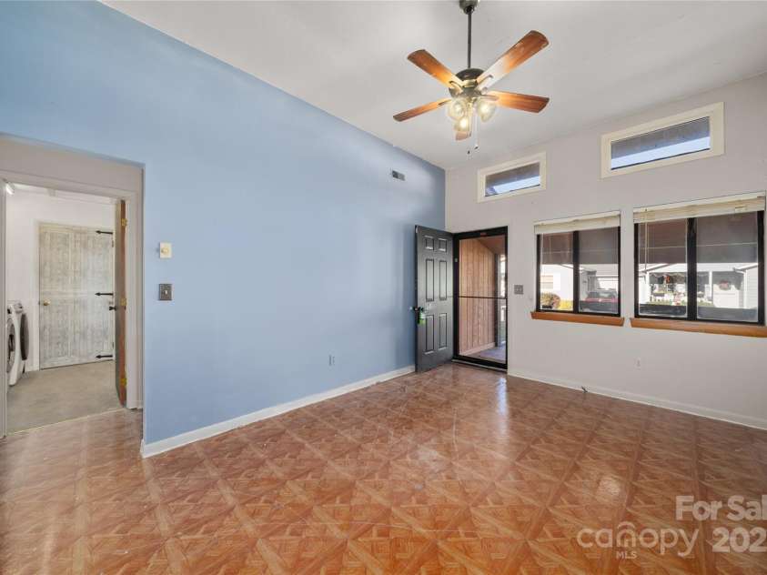 94 Market Street, Maggie Valley, NC 28751.  MLS# CAR4277066, YatesRealty ID 2228. Clarastory windows in great room