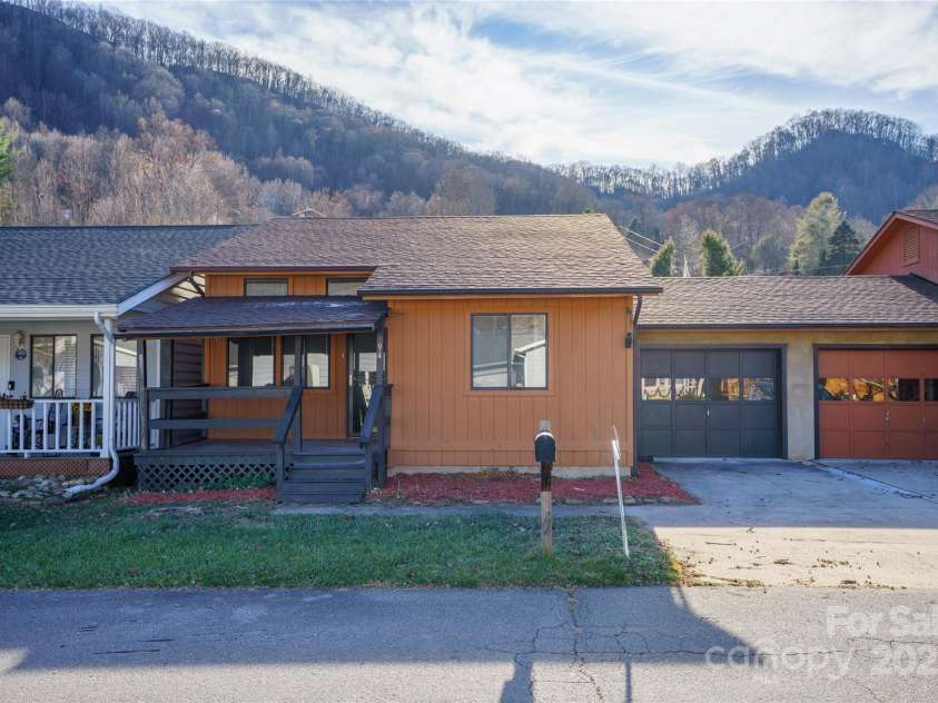 94 Market Street, Maggie Valley, NC 28751.  MLS# CAR4277066, YatesRealty ID 2228. NEw ROOF - view of the garage and parking