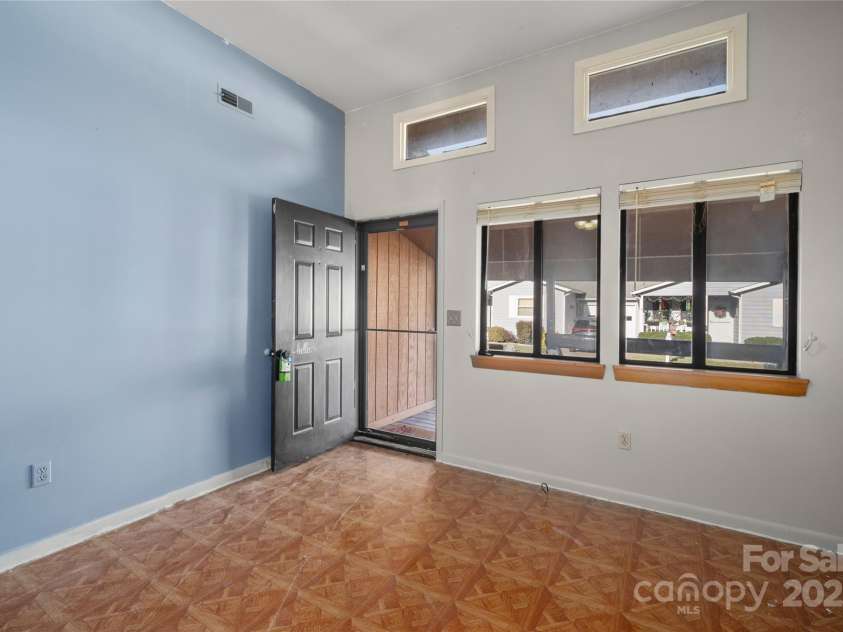 94 Market Street, Maggie Valley, NC 28751.  MLS# CAR4277066, YatesRealty ID 2228. Nine Foot ceilings add spaciousness to the main lving areas.