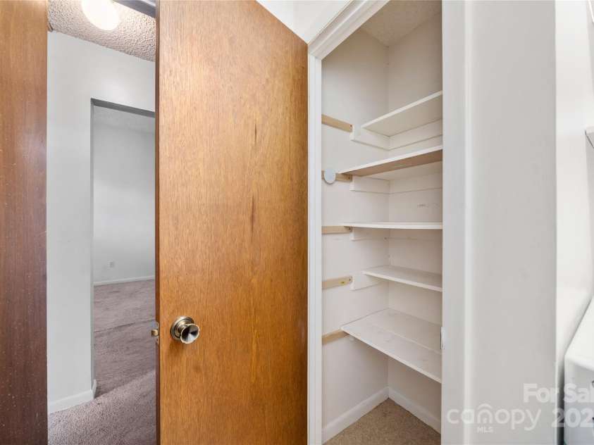 94 Market Street, Maggie Valley, NC 28751.  MLS# CAR4277066, YatesRealty ID 2228. Pantry in laundry