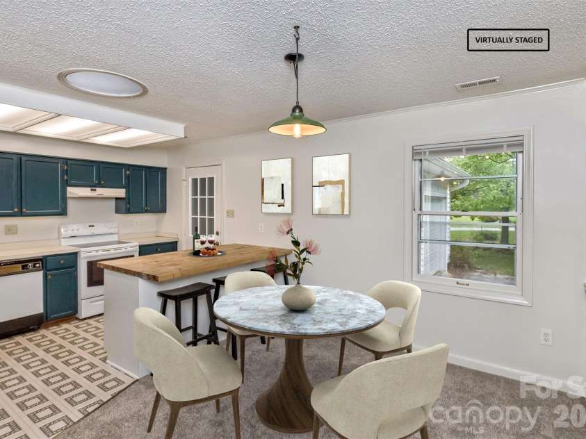 7 Teaneck Circle, Hendersonville, NC 28791.  MLS# CAR4369967, YatesRealty ID 22283. Kitchen and large butcherblock island
