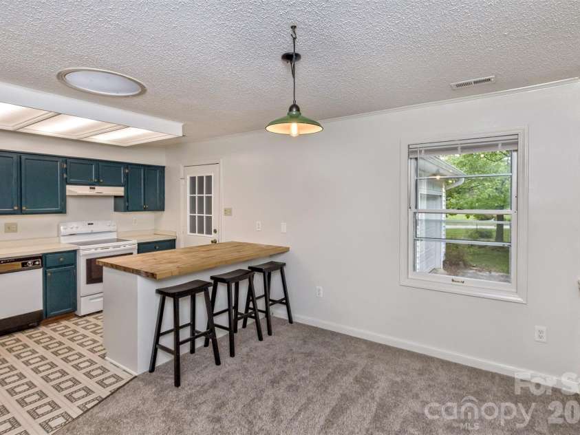 7 Teaneck Circle, Hendersonville, NC 28791.  MLS# CAR4369967, YatesRealty ID 22283. Windows everywhere  let in natural light