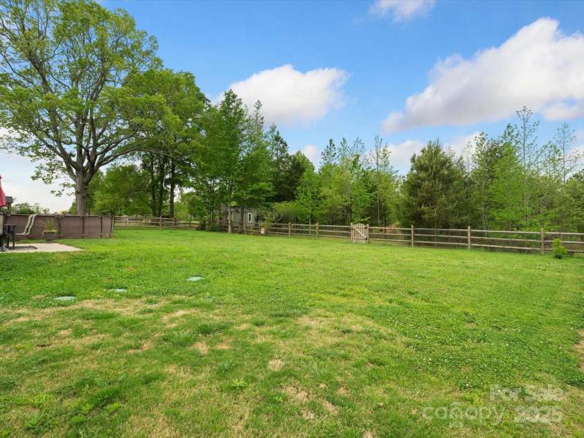 2165 Smith Road, Clover, SC 29710.  MLS# CAR4128540, YatesRealty ID 22288. View from the other side of large fenced backyard