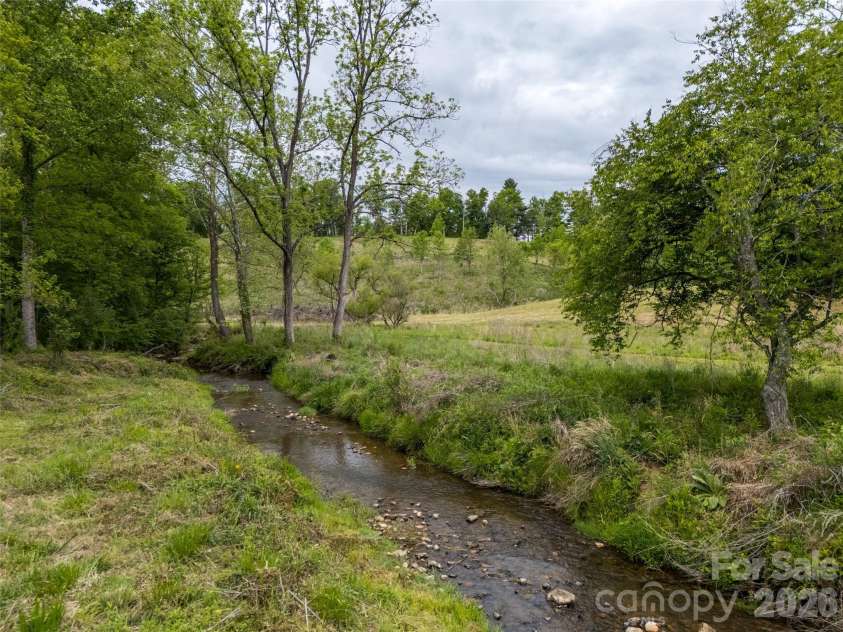 9 Squirrel Ridge Drive, Weaverville, NC 28787.  MLS# CAR4381425, YatesRealty ID 22295. Creek 