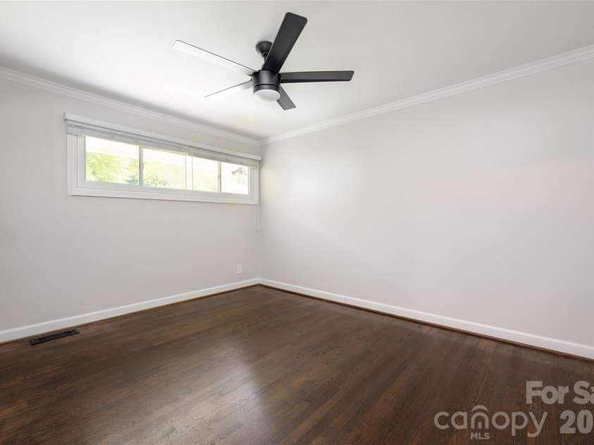 4601 General Pershing Drive, Charlotte, NC 28209.  MLS# CAR4379524, YatesRealty ID 22296. Third bedroom with ceiling fan and closet