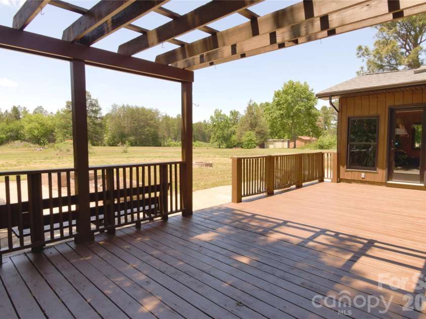 6870 Lowder Road, Salisbury, NC 28147.  MLS# CAR4368281, YatesRealty ID 22298. Newly painted deck with pergola