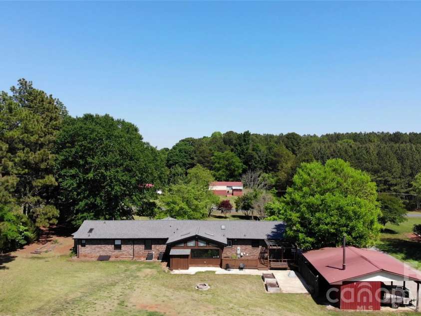 6870 Lowder Road, Salisbury, NC 28147.  MLS# CAR4368281, YatesRealty ID 22298. Rear home and carport