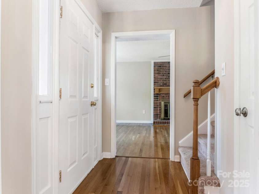 9701 Kent Village Drive, Charlotte, NC 28269.  MLS# CAR4309656, YatesRealty ID 22309. Entry, Family Room, Upstairs to bedrooms