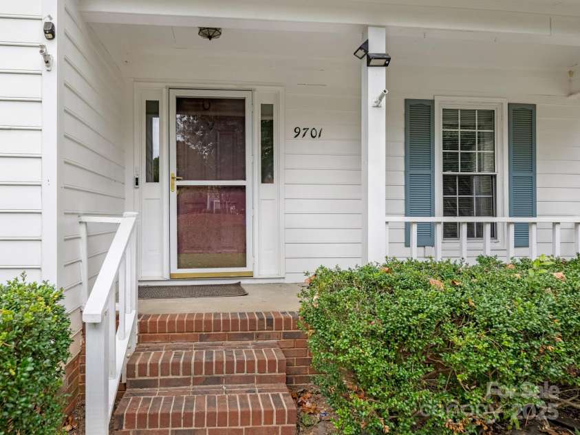 9701 Kent Village Drive, Charlotte, NC 28269.  MLS# CAR4309656, YatesRealty ID 22309. Front Covered Porch