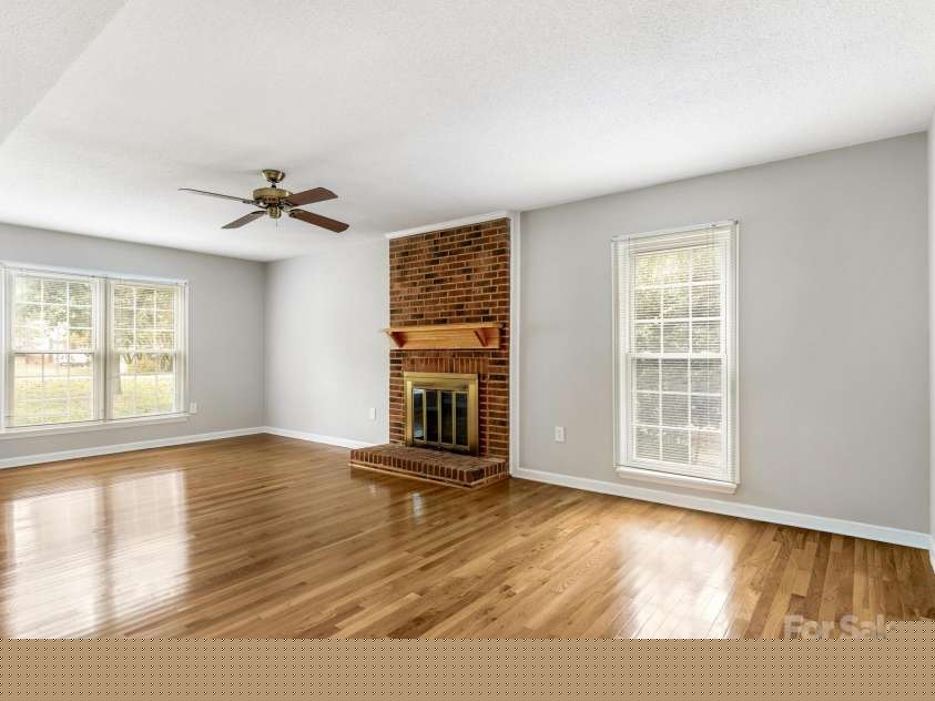 9701 Kent Village Drive, Charlotte, NC 28269.  MLS# CAR4309656, YatesRealty ID 22309. Living Room, New Paint