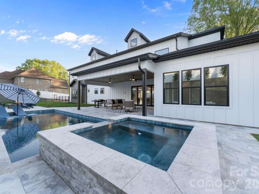475 Canvasback Road, Mooresville, NC 28117.  MLS# CAR4366182, YatesRealty ID 22319. Backyard retreat, with heated pool and spa