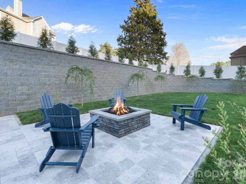 475 Canvasback Road, Mooresville, NC 28117.  MLS# CAR4366182, YatesRealty ID 22319. Dedicated fire-pit and custom landscaping