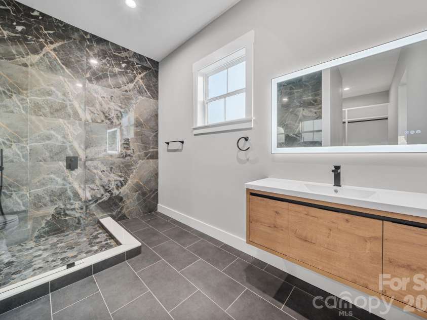475 Canvasback Road, Mooresville, NC 28117.  MLS# CAR4366182, YatesRealty ID 22319. Floor to ceiling tile and floating vanity