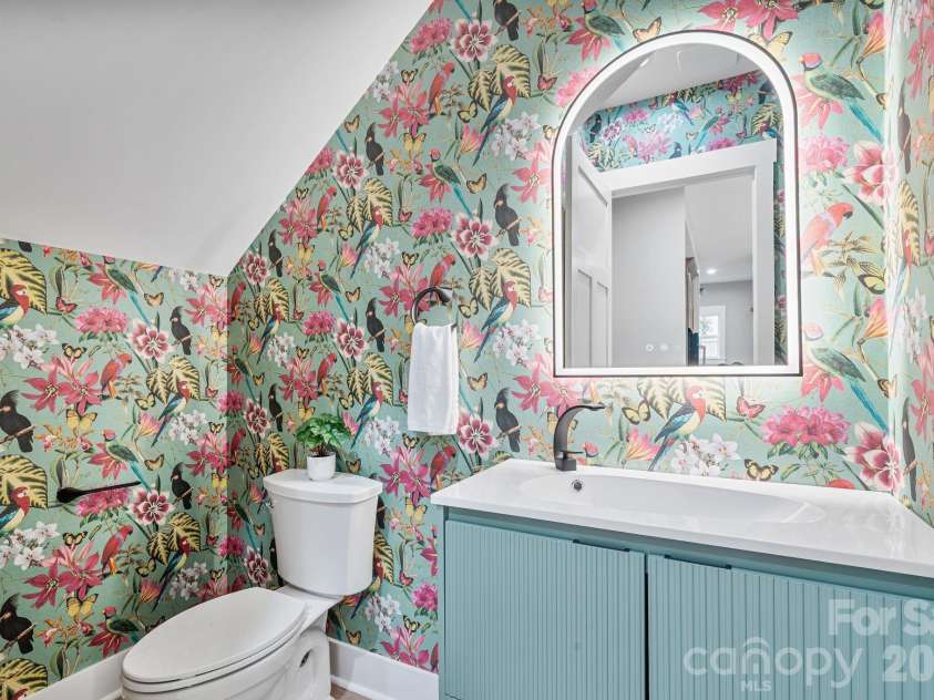 475 Canvasback Road, Mooresville, NC 28117.  MLS# CAR4366182, YatesRealty ID 22319. Half bath with floating vanity and statement wallpaper