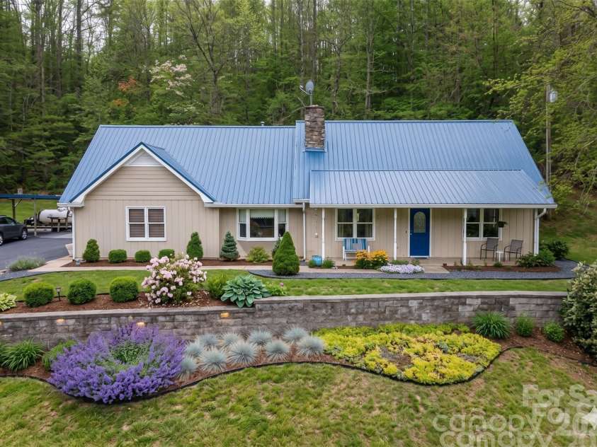 444 Martin Branch Road, Leicester, NC 28748.  MLS# CAR4369223, YatesRealty ID 22320. AI Generated Image