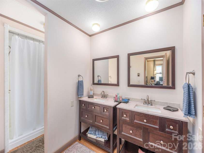 444 Martin Branch Road, Leicester, NC 28748.  MLS# CAR4369223, YatesRealty ID 22320. Primary bath with his and hers sinks