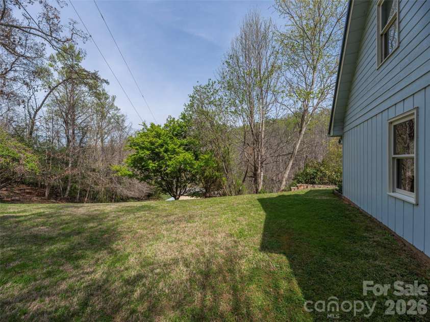 444 Martin Branch Road, Leicester, NC 28748.  MLS# CAR4369223, YatesRealty ID 22320. Right lawn