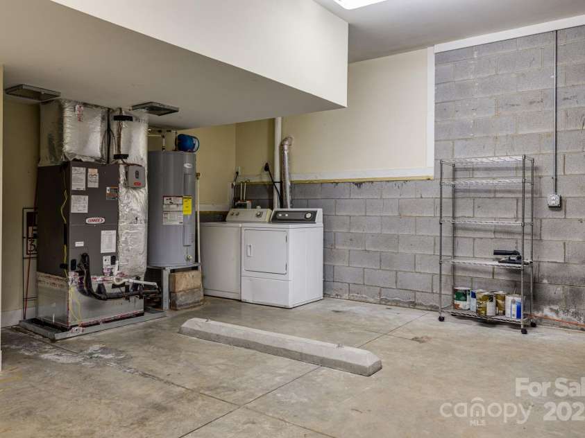 74 Elkwood Avenue, Asheville, NC 28804.  MLS# CAR4251533, YatesRealty ID 22323. Garage with laundry area and plenty of storage space!