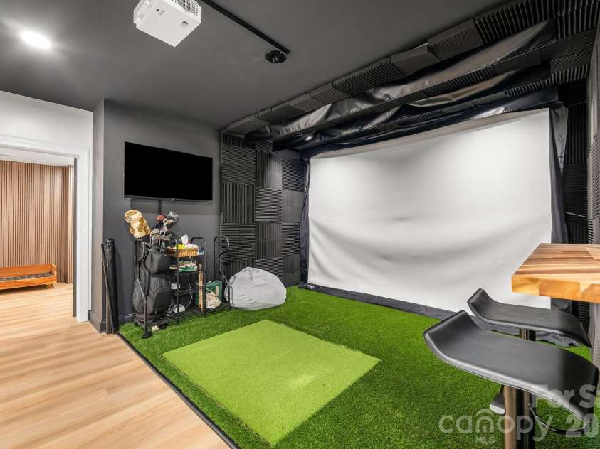 10610 Rogalla Drive, Charlotte, NC 28277.  MLS# CAR4378118, YatesRealty ID 22325. Golf simulator