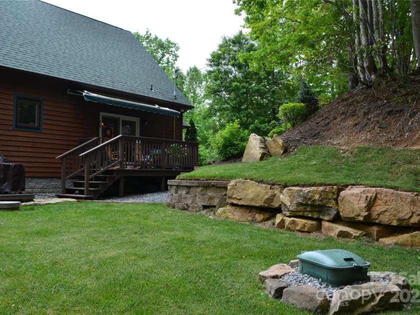 394 Hummingbird Lane, Elk Park, NC 28622.  MLS# CAR4268287, YatesRealty ID 22325. Back Yard