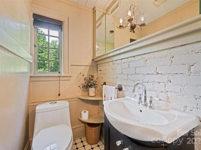 66 Fox Trot Lane, Tryon, NC 28782.  MLS# CAR4259291, YatesRealty ID 22329. Half Bath Main floor