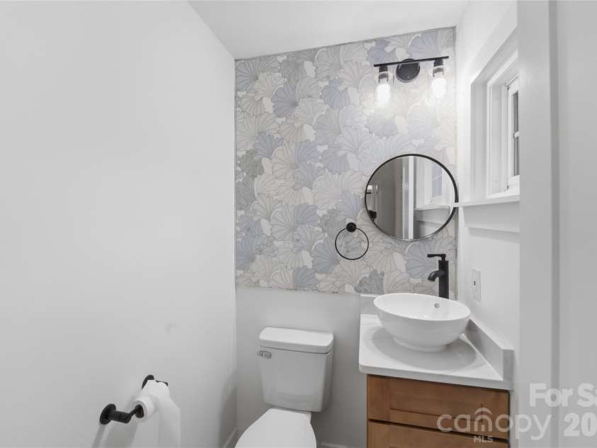 4314 Ivanhoe Place, Charlotte, NC 28205.  MLS# CAR4379977, YatesRealty ID 22333. Beautifully done half bath with ceramic tile wall detail.