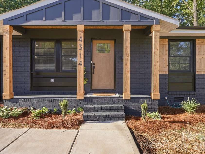 4314 Ivanhoe Place, Charlotte, NC 28205.  MLS# CAR4379977, YatesRealty ID 22333. Solid beams match shutters and batten board siding adorns porch ceiling.