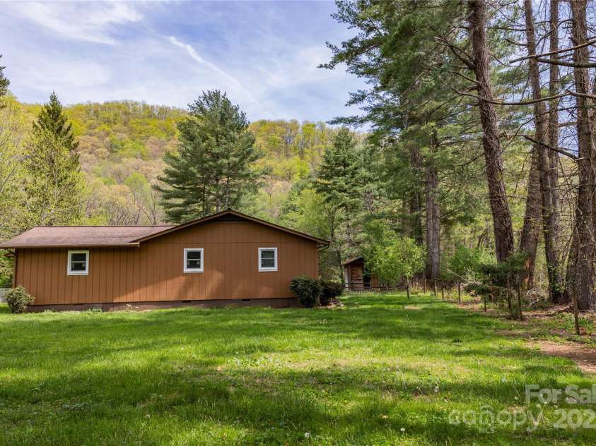 205 Blackwood Road, Cullowhee, NC 28723.  MLS# CAR4249157, YatesRealty ID 22339. Back yard