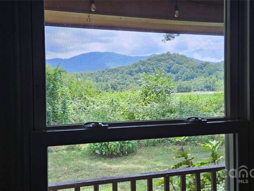 205 Blackwood Road, Cullowhee, NC 28723.  MLS# CAR4249157, YatesRealty ID 22339. Beautiful Mountain View from Bedroom overlooking front yard